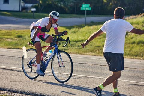 A cyclist riding at golden hour